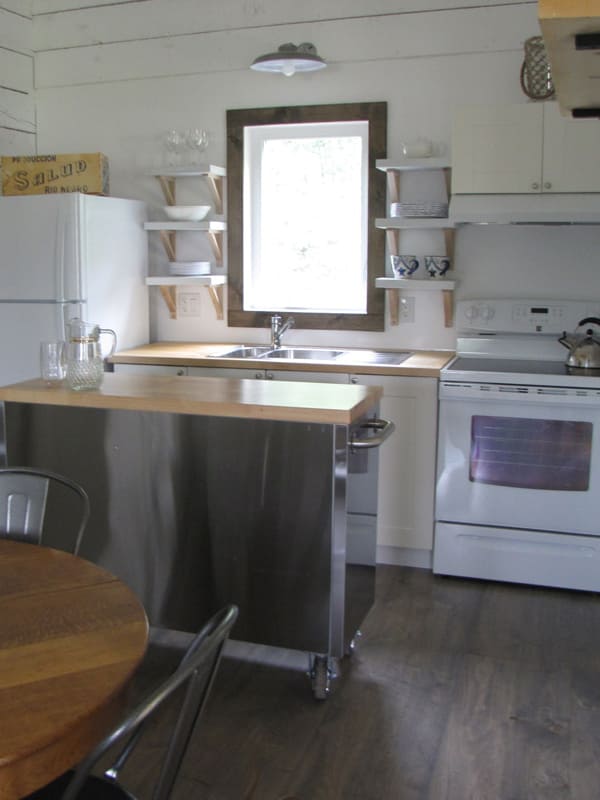 White kitchen in cottage at Waters Edge with window